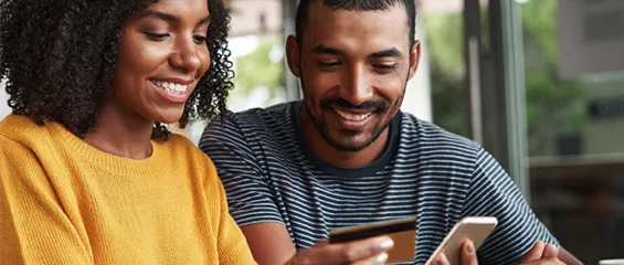 photo of a couple shopping on a smart phone