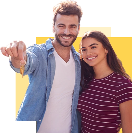 smiling couple showing off house keys