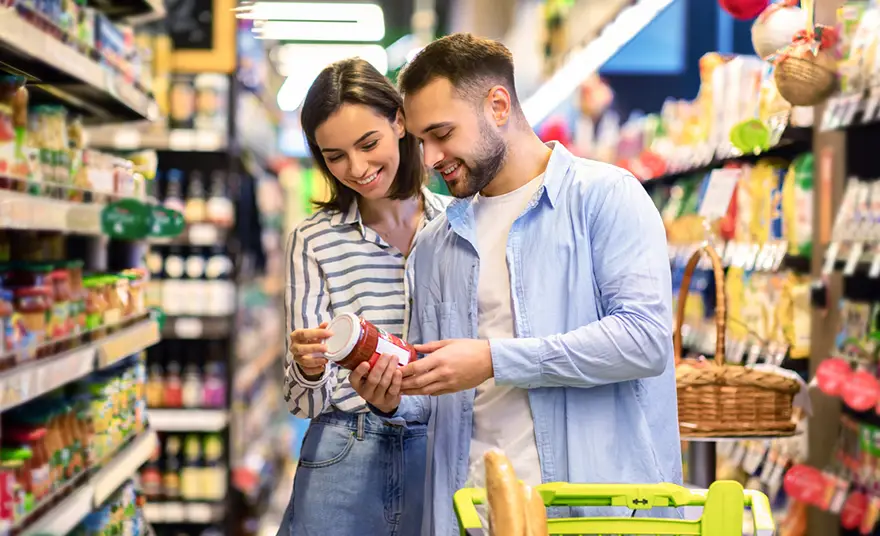 photo of a couple shopping at the grocery store together