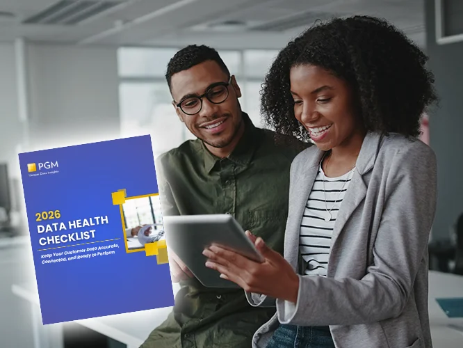 the cover of the 2026 data checklist ebook overlayed on a photo of two businesspeople looking at a tablet