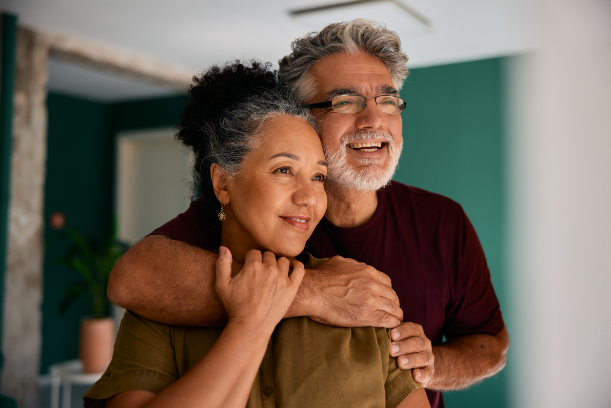 Happy senior couple embracing and looking away at home Retirees and Downsizers Are One of the Most Overlooked High-Intent Audiences