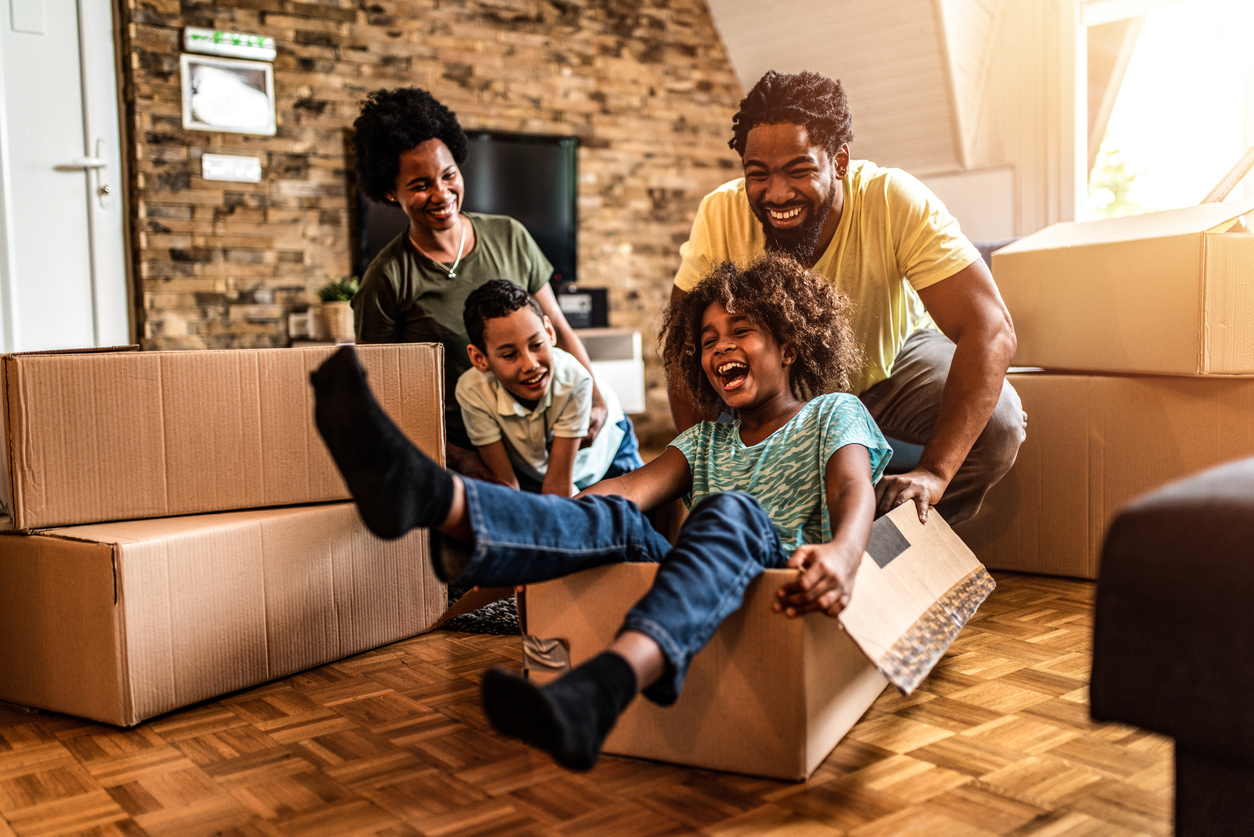 Happy family moving in their new house. Why Movers Still Matter in 2026