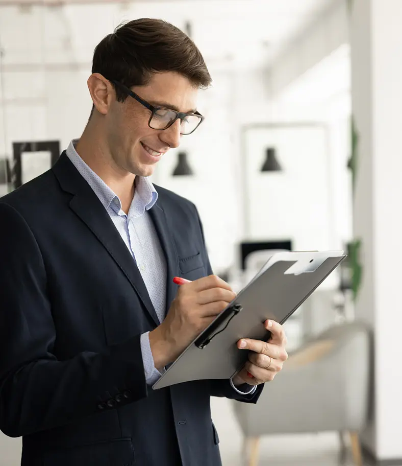 09-young-businessman-iStock-2244669410 photo of a young businessman smiling